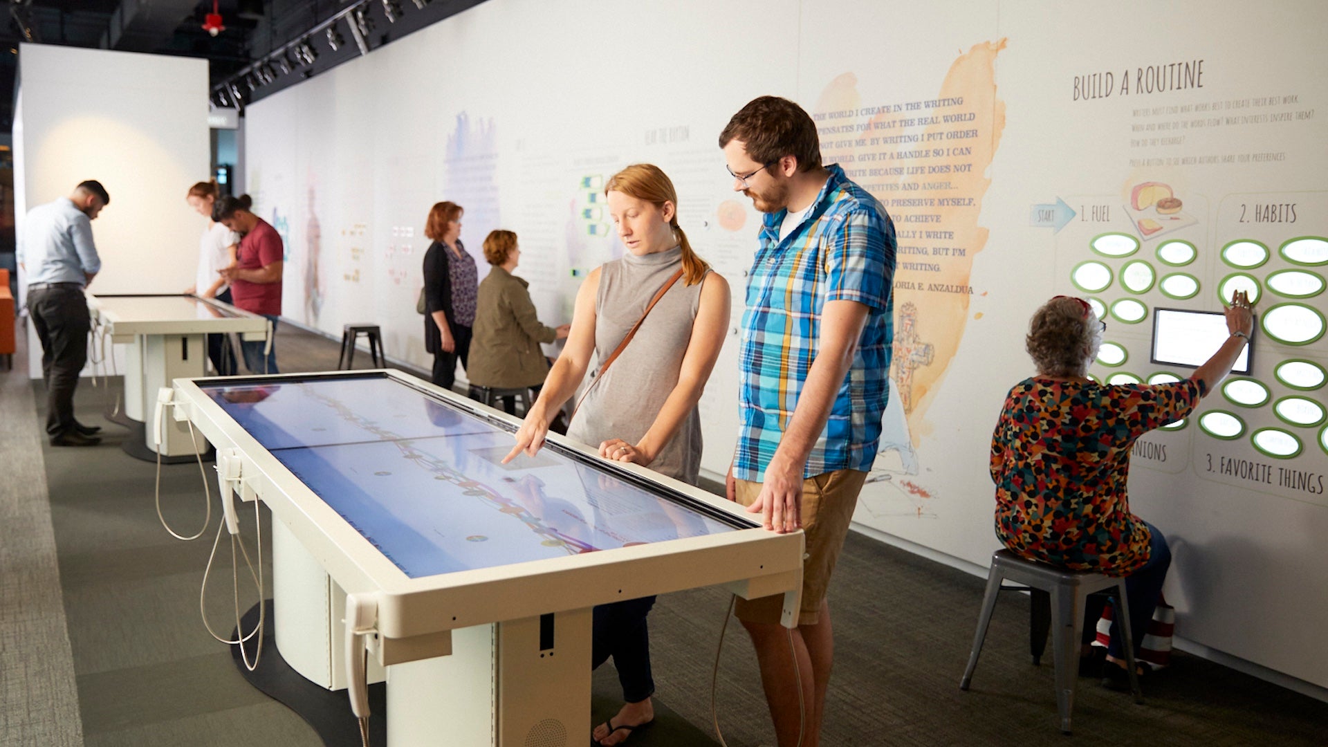 Several people experiencing the different exhibits at the American Writers Museum